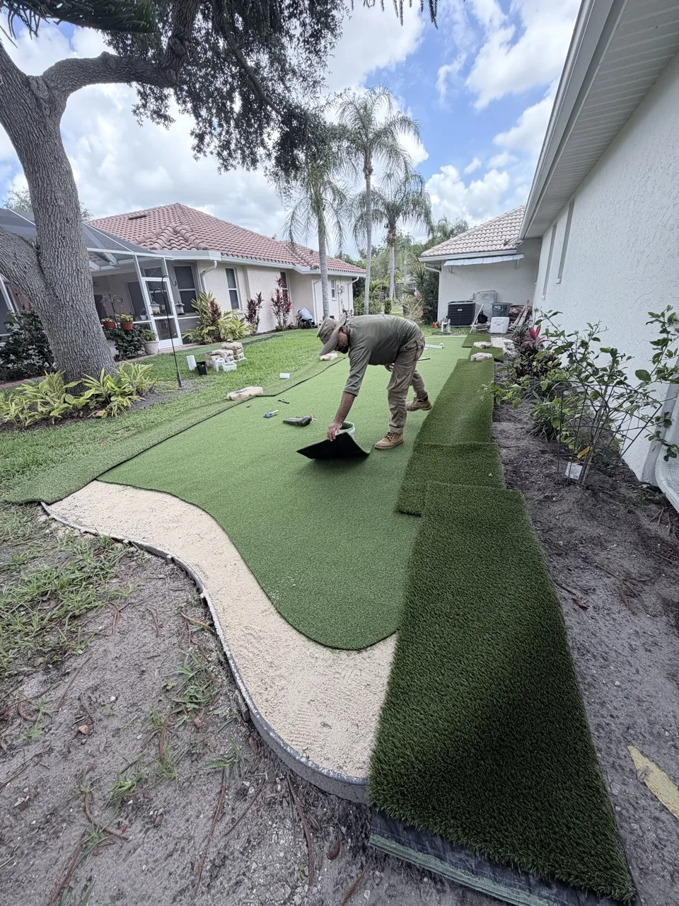 Master360 Services crew finishing an artificial turf installation