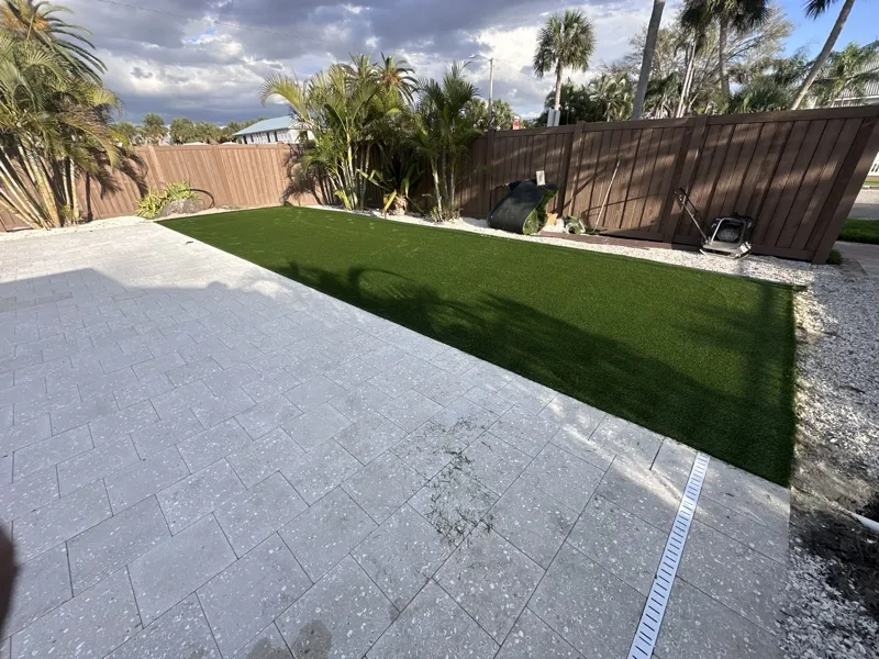 Artificial turf and paver hardscape by Master360 Services in Palmetto, FL